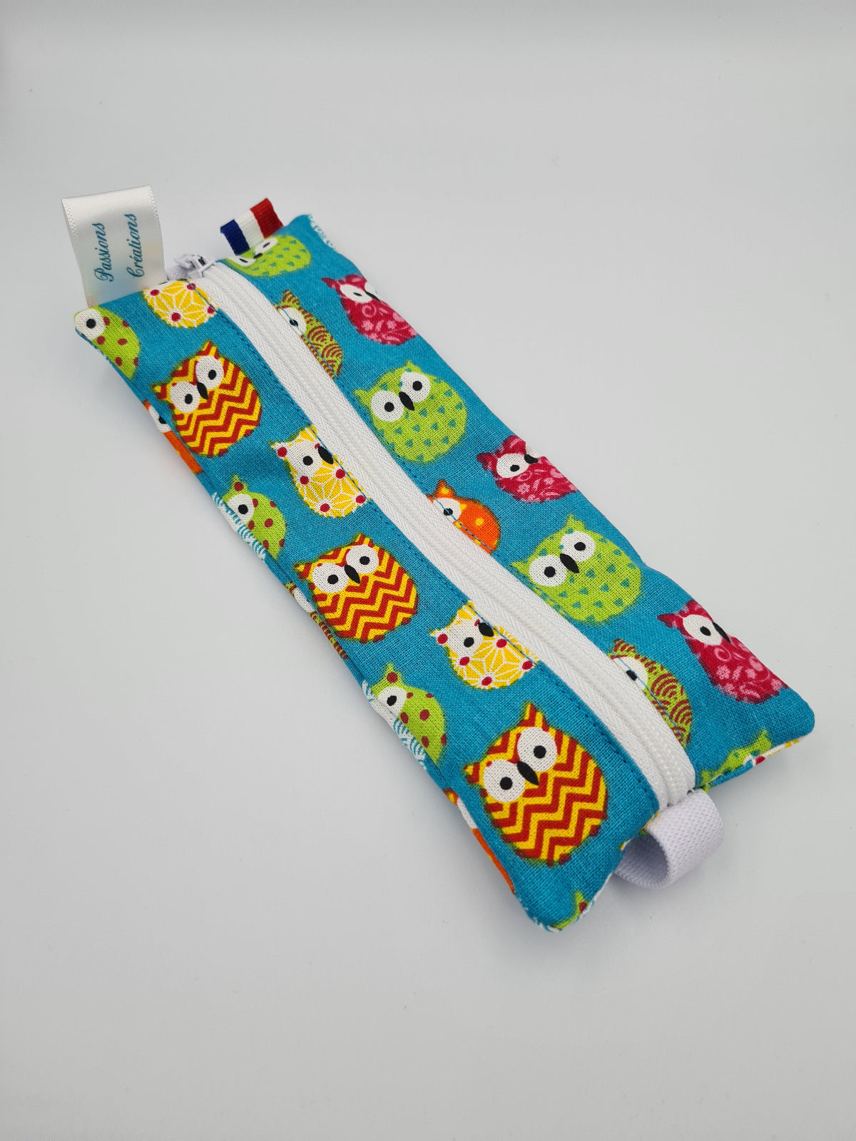 trousse pour carnet hiboux multicolore sur fond bleu